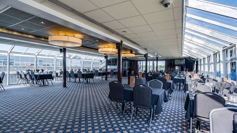 View of the private room on board the AML Cavalier Maxim ship with set tables.